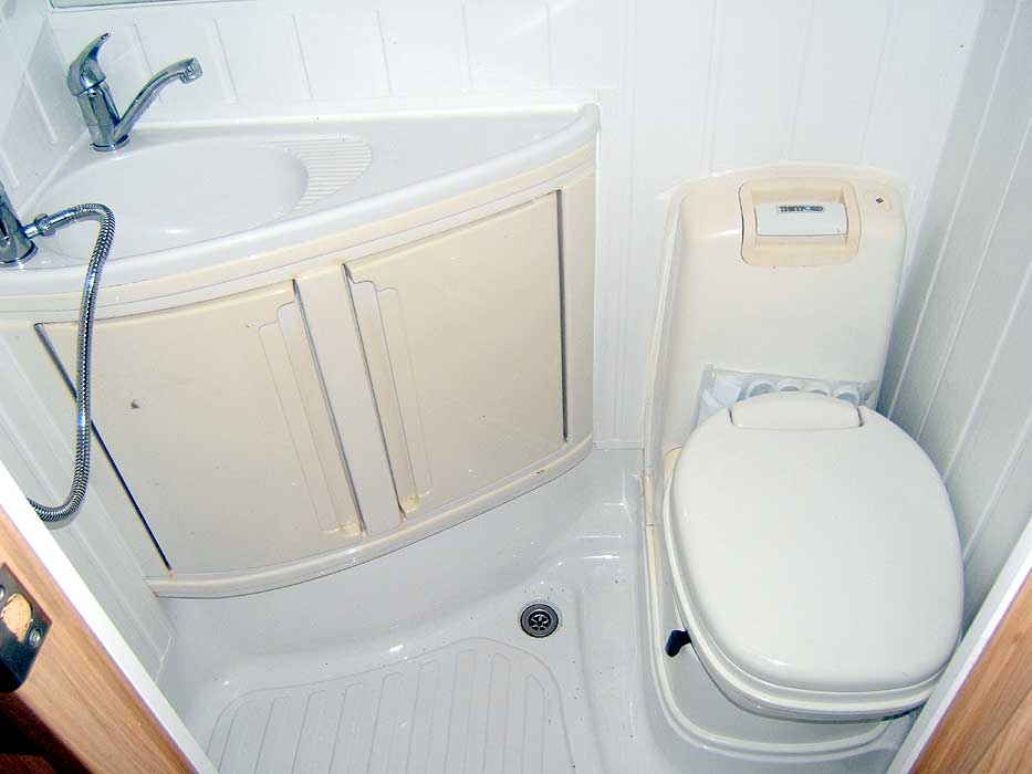 The cassette toilet and washbasin.